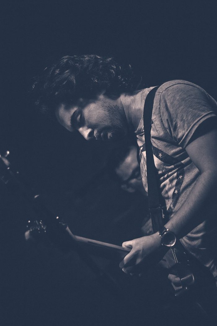 Matthew Irvine performing on guitar